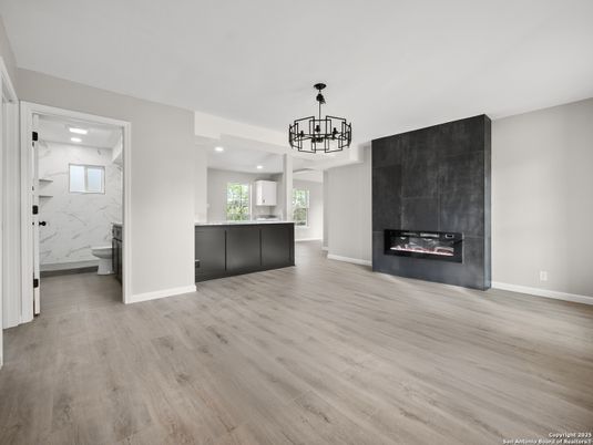Bathroom, Chandelier, Empty room, Fireplace, Interior, Marble Walls, Recessed Lighting, Wood Texture Flooring