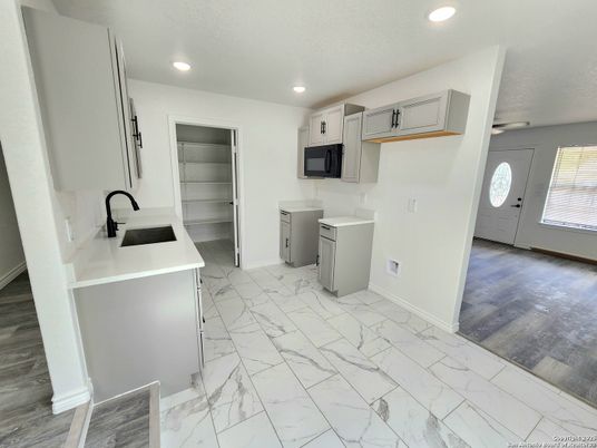 Interior, Kitchen, Marble, Recessed Lighting, Washer, Wood Texture Flooring