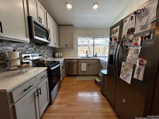 Interior, Kitchen, Recessed Lighting, Stainless Steel Appliances, Wood Texture Flooring