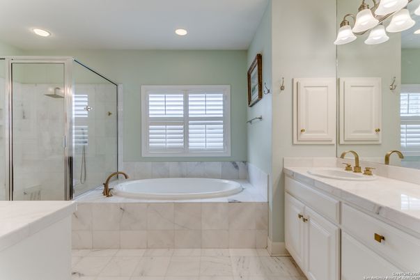 Bathroom, Dual Sink Vanities, Glass Shower, Interior, Marble, Recessed Lighting, Tile Countertops