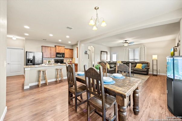 Chandelier, Dining room, Interior, Kitchen, Living room, Recessed Lighting, Stainless Steel Appliances, Wood Texture Flooring