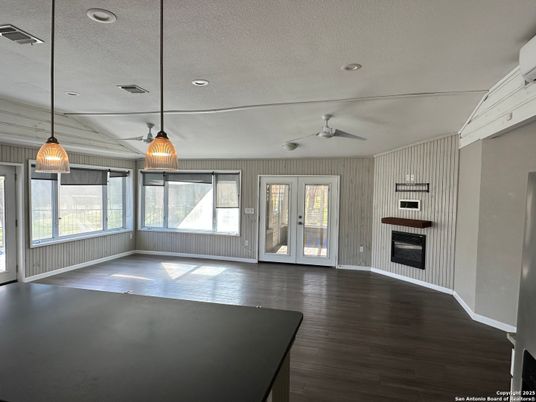 Empty room, Fireplace, Interior, Pendant Lights, Recessed Lighting, Wood Texture Flooring