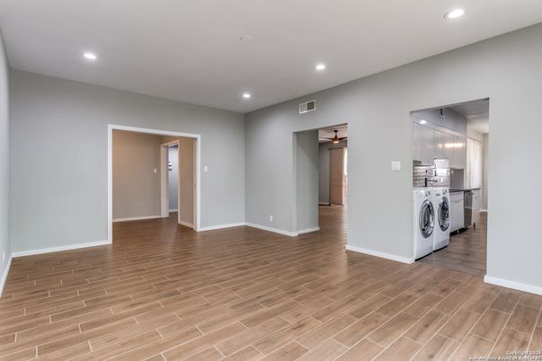 Empty room, Interior, Recessed Lighting, Utility Closets, Washer, Wood Texture Flooring