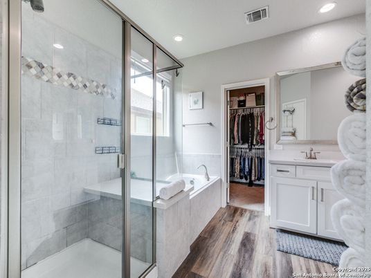 Bathroom, Dual Sink Vanities, Glass Shower, Interior, Recessed Lighting, Walk-in Closets, Wood Texture Flooring