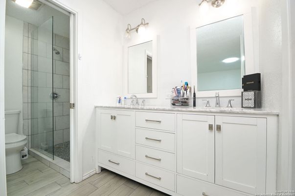 Bathroom, Dual Sink Vanities, Glass Shower, Interior, Wood Texture Flooring