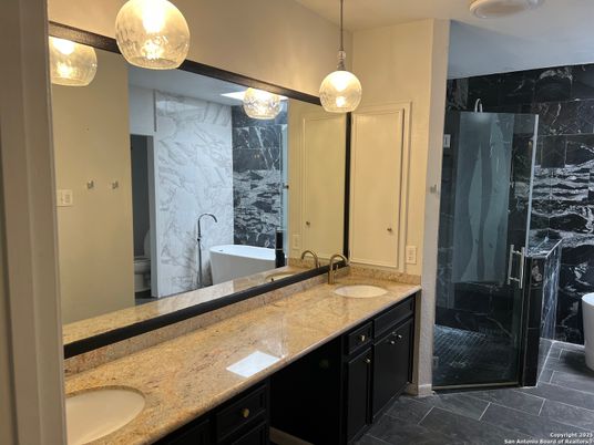 Bathroom, Dual Sink Vanities, Glass Shower, Interior, Marble Walls, Pendant Lights