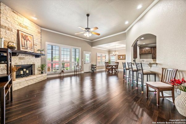 Chandelier, Dining room, Fireplace, Interior, Pendant Lights, Recessed Lighting, Stone Walls, Wood Texture Flooring