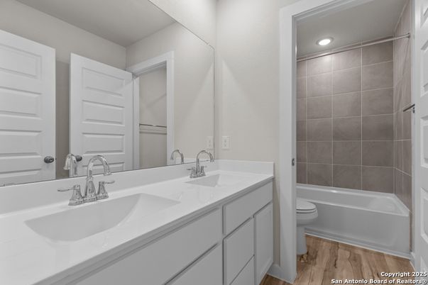 Bathroom, Dual Sink Vanities, Interior, Recessed Lighting, Wood Texture Flooring