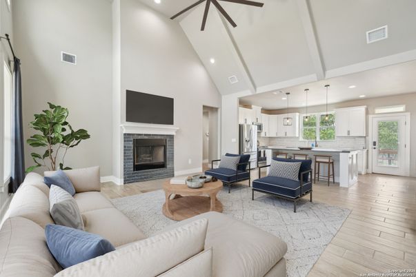 Fireplace, Interior, Kitchen, Living room, Pendant Lights, Recessed Lighting, Stainless Steel Appliances, Wood Texture Flooring