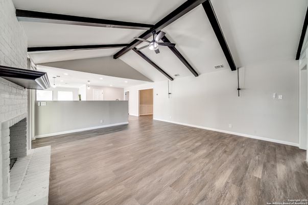 Empty room, Fireplace, Interior, Pendant Lights, Recessed Lighting, Wooden Beams, Wood Texture Flooring