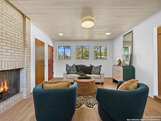 Fireplace, Interior, Living room, Recessed Lighting, Stone Walls, Wood Texture Flooring