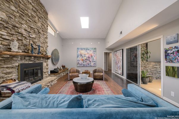 Fireplace, Interior, Living room, Recessed Lighting, Stone Walls, Wood Texture Flooring