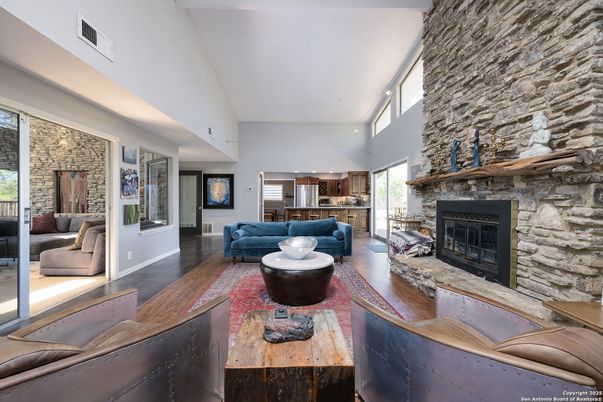 Fireplace, Interior, Living room, Recessed Lighting, Stone Walls, Wood Texture Flooring