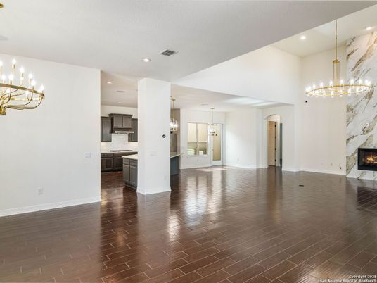 Chandelier, Empty room, Fireplace, Interior, Kitchen, Pendant Lights, Recessed Lighting, Wood Texture Flooring