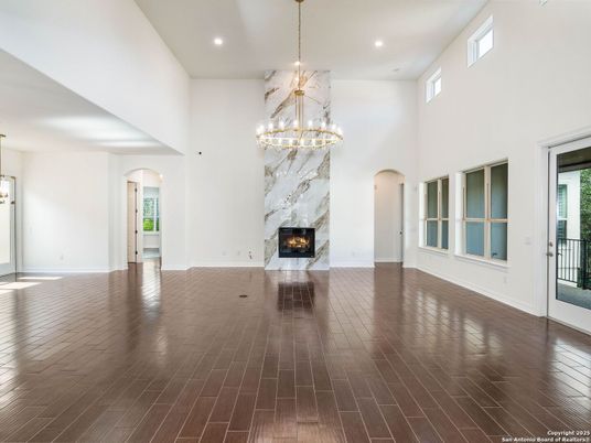 Chandelier, Empty room, Fireplace, Interior, Pendant Lights, Recessed Lighting, Wood Texture Flooring