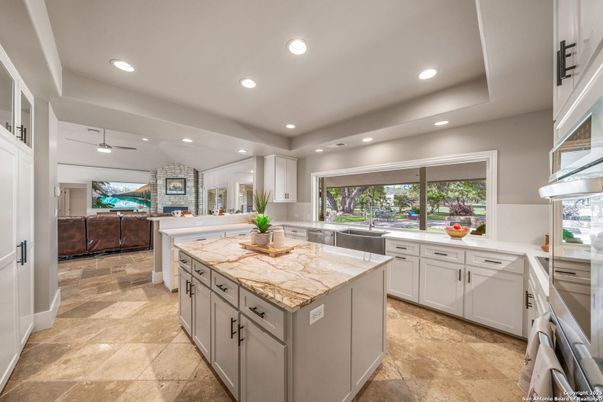 Fireplace, Interior, Kitchen, Recessed Lighting, Stainless Steel Appliances, Stone Walls
