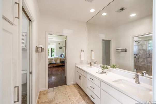 Bathroom, Bedroom, Dual Sink Vanities, Glass Shower, Interior, Recessed Lighting, Wood Texture Flooring