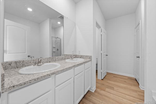 Bathroom, Dual Sink Vanities, Interior, Recessed Lighting, Wood Texture Flooring