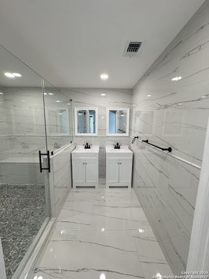 Bathroom, Dual Sink Vanities, Glass Shower, Interior, Marble, Marble Walls, Recessed Lighting