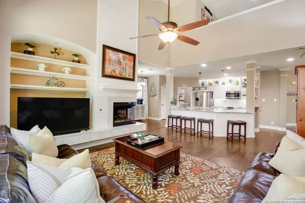 Fireplace, Interior, Kitchen, Living room, Recessed Lighting, Stainless Steel Appliances, Wood Texture Flooring