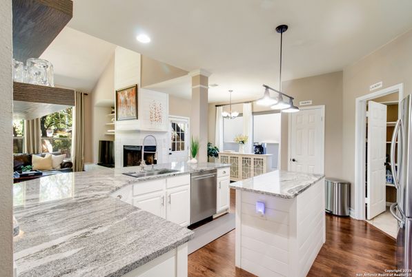 Fireplace, Interior, Kitchen, Pendant Lights, Recessed Lighting, Stainless Steel Appliances, Wood Texture Flooring
