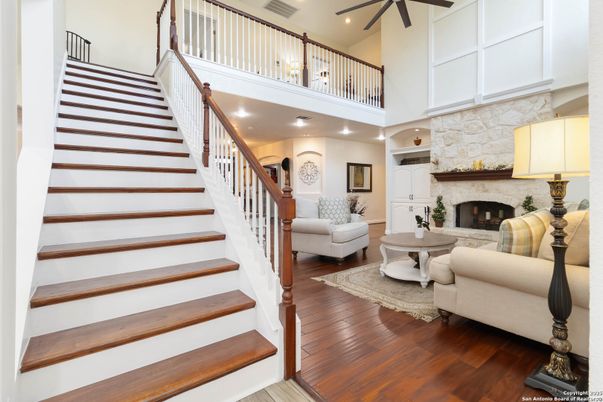 Fireplace, Interior, Living room, Recessed Lighting, Stone Walls, Wood Texture Flooring