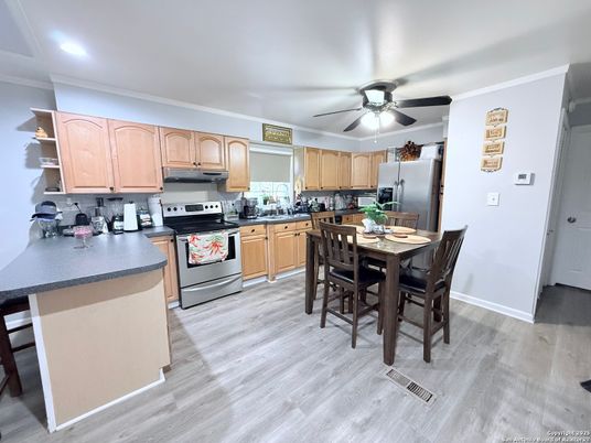 Dining room, Interior, Kitchen, Recessed Lighting, Stainless Steel Appliances, Wood Texture Flooring