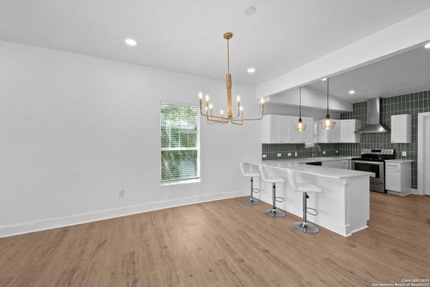 Chandelier, Interior, Kitchen, Pendant Lights, Recessed Lighting, Stainless Steel Appliances, Wood Texture Flooring