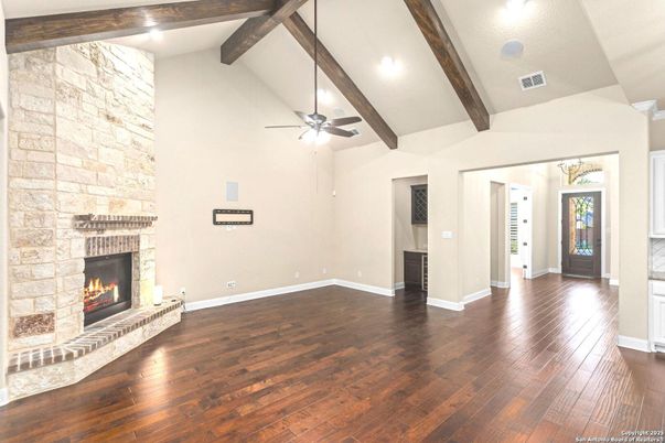Empty room, Fireplace, Interior, Recessed Lighting, Stone Walls, Wooden Beams, Wood Texture Flooring