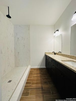 Bathroom, Dual Sink Vanities, Interior, Marble Walls, Wood Texture Flooring