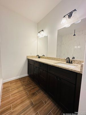 Bathroom, Dual Sink Vanities, Interior, Marble Walls, Wood Texture Flooring