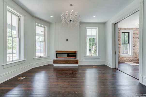Chandelier, Empty room, Fireplace, Interior, Recessed Lighting, Wood Texture Flooring