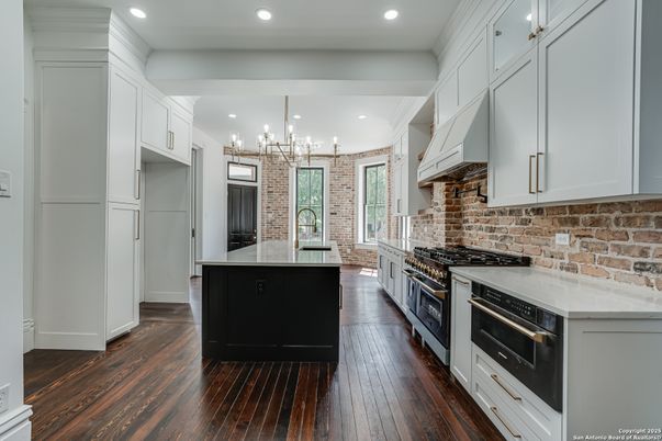 Chandelier, Interior, Kitchen, Recessed Lighting, Stainless Steel Appliances, Stone Walls, Wood Texture Flooring