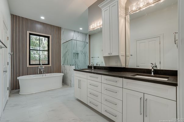 Bathroom, Dual Sink Vanities, Free Standing Baths, Interior, Marble, Marble Walls, Recessed Lighting