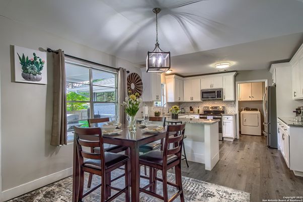 Dining room, Interior, Kitchen, Pendant Lights, Stainless Steel Appliances, Wood Texture Flooring