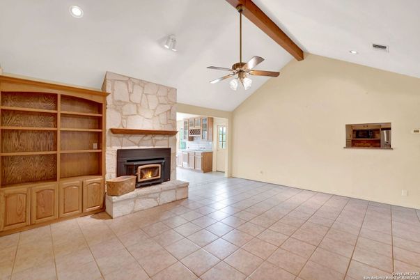 Empty room, Fireplace, Interior, Recessed Lighting, Stone Walls, Wooden Beams