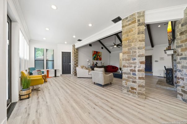 Fireplace, Interior, Living room, Recessed Lighting, Stone Walls, Wood Texture Flooring