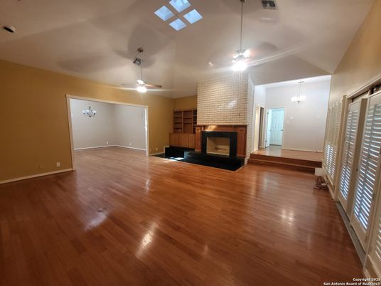 Empty room, Fireplace, Interior, Pendant Lights, Stone Walls, Wood Texture Flooring