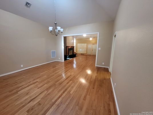 Chandelier, Empty room, Fireplace, Interior, Wood Texture Flooring