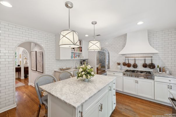 Interior, Kitchen, Pendant Lights, Recessed Lighting, Stainless Steel Appliances, Stone Walls, Wood Texture Flooring