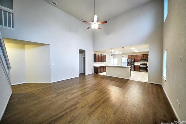 Empty room, Interior, Kitchen, Pendant Lights, Stainless Steel Appliances, Wood Texture Flooring