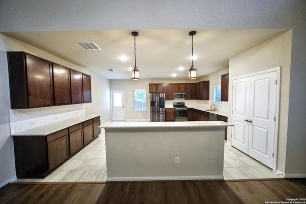 Interior, Kitchen, Pendant Lights, Recessed Lighting, Stainless Steel Appliances, Wood Texture Flooring