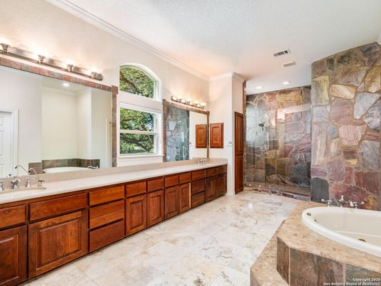 Bathroom, Dual Sink Vanities, Glass Shower, Interior, Recessed Lighting, Stone Walls