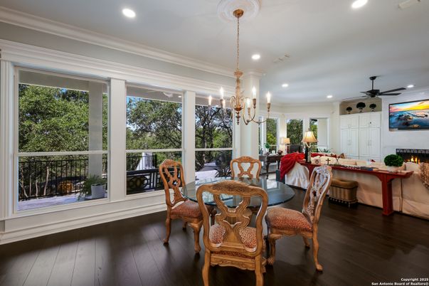 Chandelier, Dining room, Fireplace, Interior, Living room, Recessed Lighting, Wood Texture Flooring