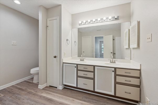 Bathroom, Dual Sink Vanities, Interior, Recessed Lighting, Wood Texture Flooring