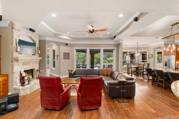 Dining room, Fireplace, Interior, Living room, Pendant Lights, Recessed Lighting, Wood Texture Flooring