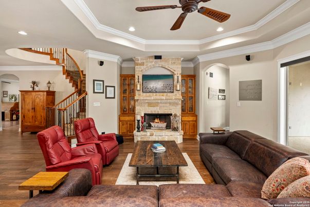 Fireplace, Interior, Living room, Recessed Lighting, Stone Walls, Wood Texture Flooring