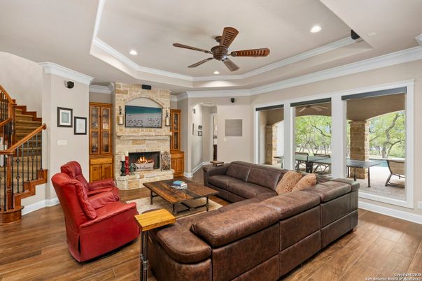 Fireplace, Interior, Living room, Recessed Lighting, Stone Walls, Wood Texture Flooring