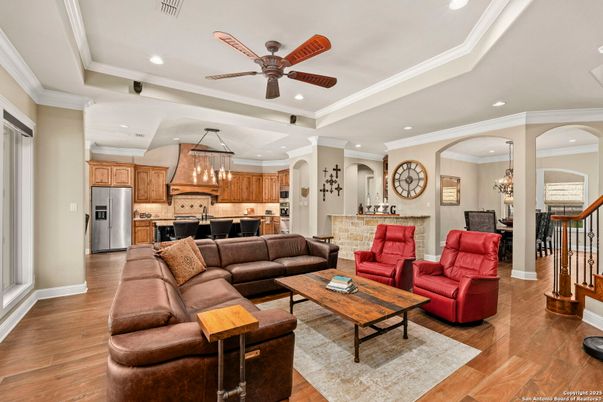 Chandelier, Interior, Kitchen, Living room, Pendant Lights, Recessed Lighting, Stainless Steel Appliances, Wood Texture Flooring
