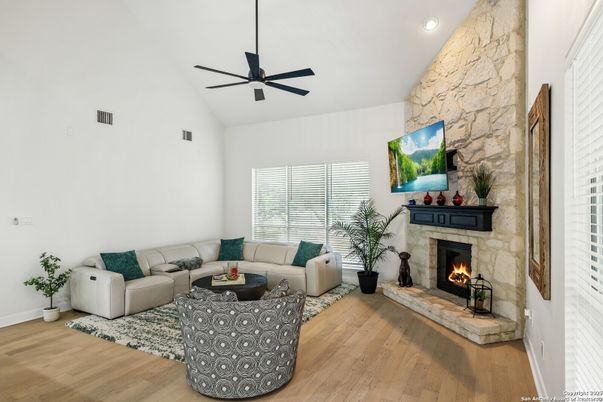Fireplace, Interior, Living room, Recessed Lighting, Stone Walls, Wood Texture Flooring